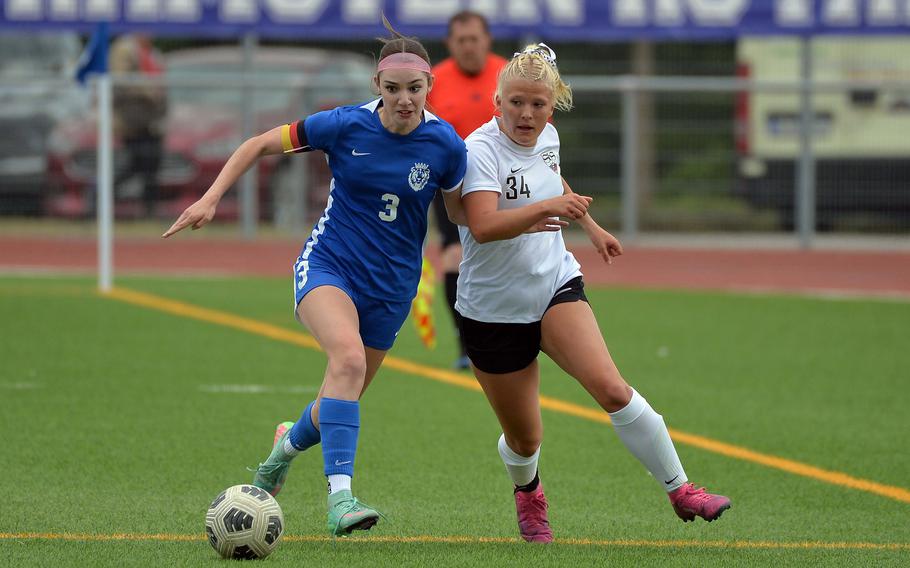 Ramstein’s Isabella Donkin, left, and Stuttgart’s Brielle Aplanalp fight for the ball along the sideline  in the girls Division I title game at the DODEA-Europe soccer championships in Ramstein, Germany, May 22, 2025. The Royals won 3-1.