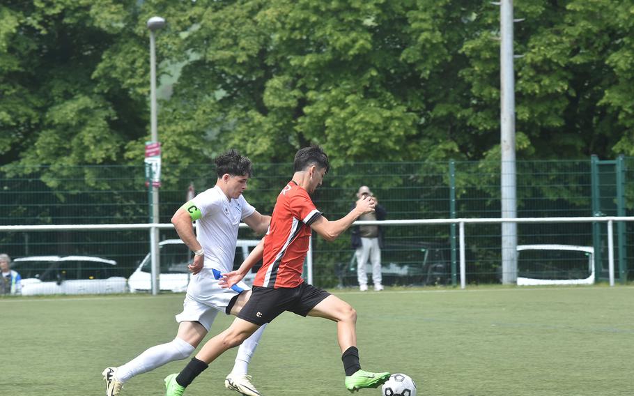 American Overseas School of Rome's Valerio Di Cesare, right, and Marymount's Giovanni Folio race down the field with the ball during a semifinal between the two teams Wednesday, May 22, 2024, at the DODEA European Division II boys soccer championships in Reichenbach-Steegen, Germany.