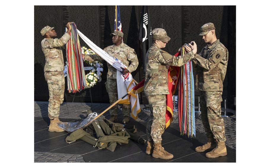 Soldiers from the Military District of Washington prepare the colors for a National Vietnam War Veterans Day ceremony in Washington, D.C., March 29, 2024.