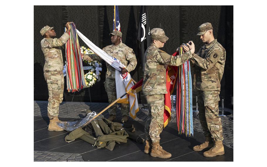 Soldiers prepare the colors