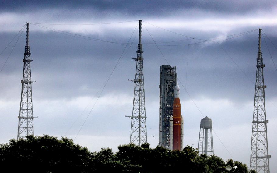 Storm clouds linger over Artemis I, NASAs Space Launch System heavy-lift rocket carrying the Orion spacecraft, as it sits at Launch Pad 39-B at Kennedy Space Center, Fla., Aug. 28, 2022.