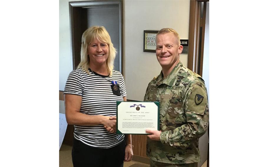 Cindy McAleese, seen in a September 2017 post, receives the Achievement Medal for Civilian Service for her outstanding contributions as a member of Fort Drum’s Installation Support Division team. On Tuesday, Jan. 16, 2024, McAleese pleaded guilty to conspiracy to commit an offense against the United States.