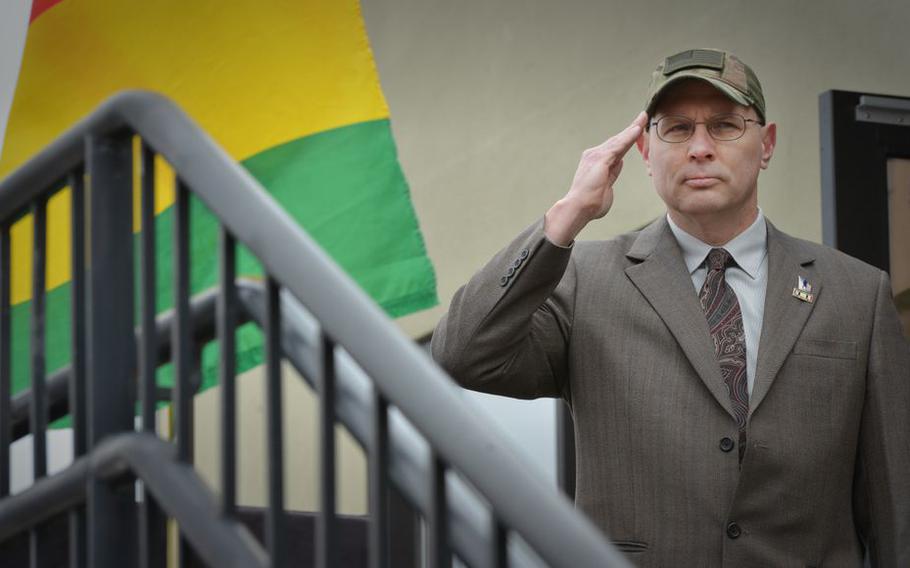 John Paradis, a former deputy superintendent for the Holyoke Soldiers' Home, salutes at a National Vietnam War Veterans Day ceremony in West Springfield, Mass., in March 2018.