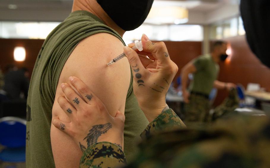 U.S. Marine Corps Sgt. Maj. Curtis A. Rice, sergeant major for 11th Marine Regiment, 1st Marine Division, receives the COVID-19 vaccination on Marine Corps Base Camp Pendleton, Calif., Jan. 15, 2021. 