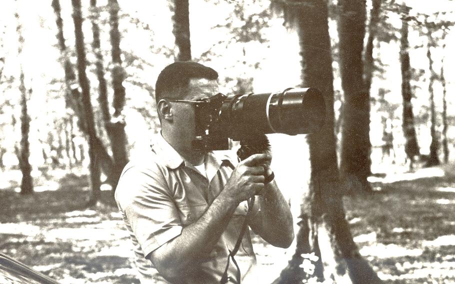Retired U.S. Air Force Lt. Col. Bill Burhans is seen here snapping a photo during his time with the USMLM in Germany.