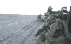 Fallujah, Iraq, September, 2003: Second Lt. John Bradley takes his position as rounds come in just minutes after his unit left a base in Iraq.