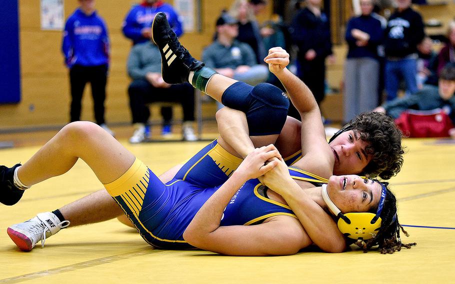 Wiesbaden's Wyatt Massey tries to pin teammate Samia Calloway during a second-round 157-pound match at the Warrior Wraggle on Jan. 13, 2024, at Wiesbaden High School in Wiesbaden, Germany.