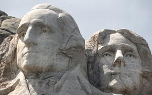Washington and Jefferson carved into stone at Mount Rushmore.