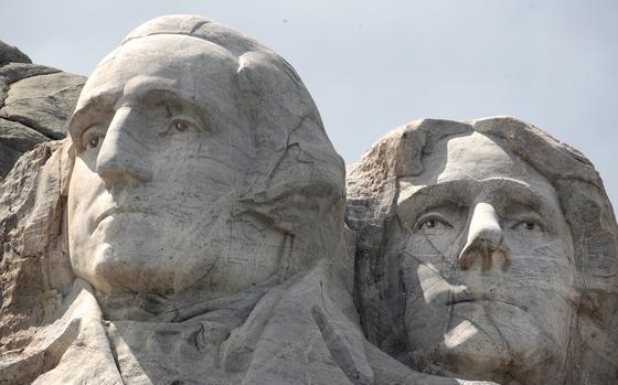 Washington and Jefferson carved into stone at Mount Rushmore.