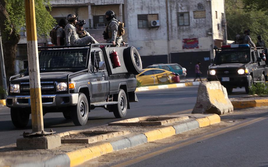 Popular Mobilization Forces patrol outside the heavily fortified Green Zone in Baghdad, Iraq, on May 26, 2021.