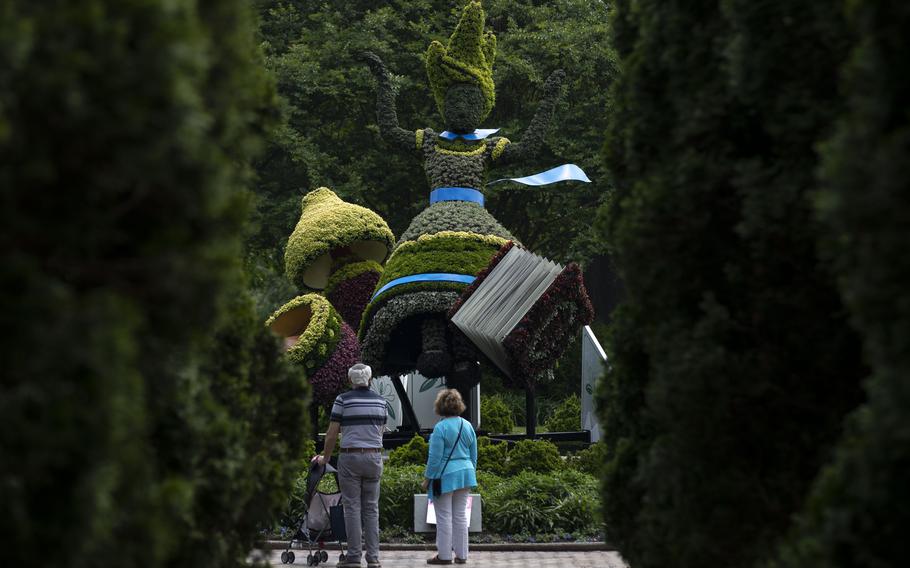 An Alice topiary stands in the “Alice’s Adventures in the Garden” exhibit at Memphis Botanic Garden May 10 in Memphis, Tenn. The exhibit will remain open until Oct. 31. 