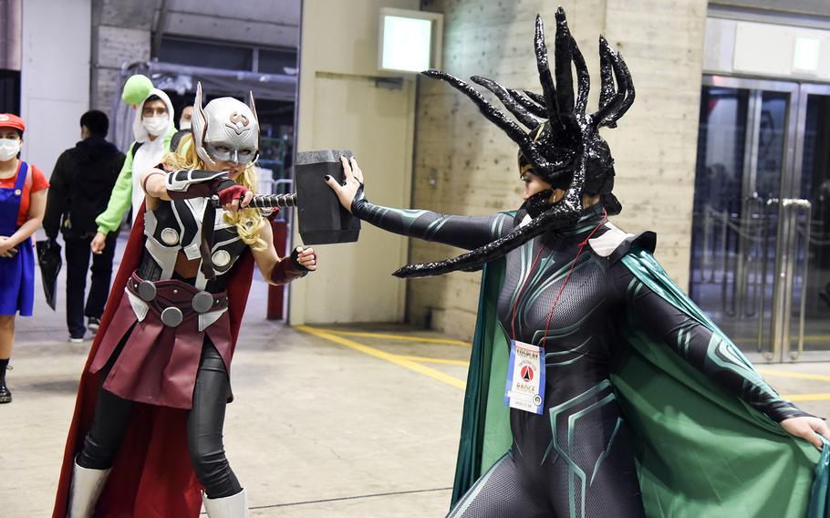 Cosplayers act out a battle scene from “Thor: Ragnarok” during Tokyo Comic Con at the Makuhari Messe convention center in Chiba, east of central Tokyo, Nov. 25, 2022. 