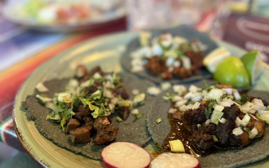 A serving of tacos al pastor, birria and carne asada.