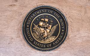 A photo of the U.S. Navy crest.
