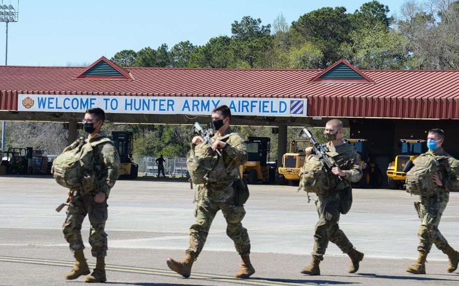 
Fort Stewart soldiers with the 3rd Battalion, 69th Armored Regiment of the 3rd Infantry Division’s 1st Armored Brigade Combat Team board a flight bound for Germany out of Hunter Army Airfield, Ga., on Wednesday, March 2, 2022. The brigade was ordered to Europe on a short-notice deployment after Russia invaded Ukraine.