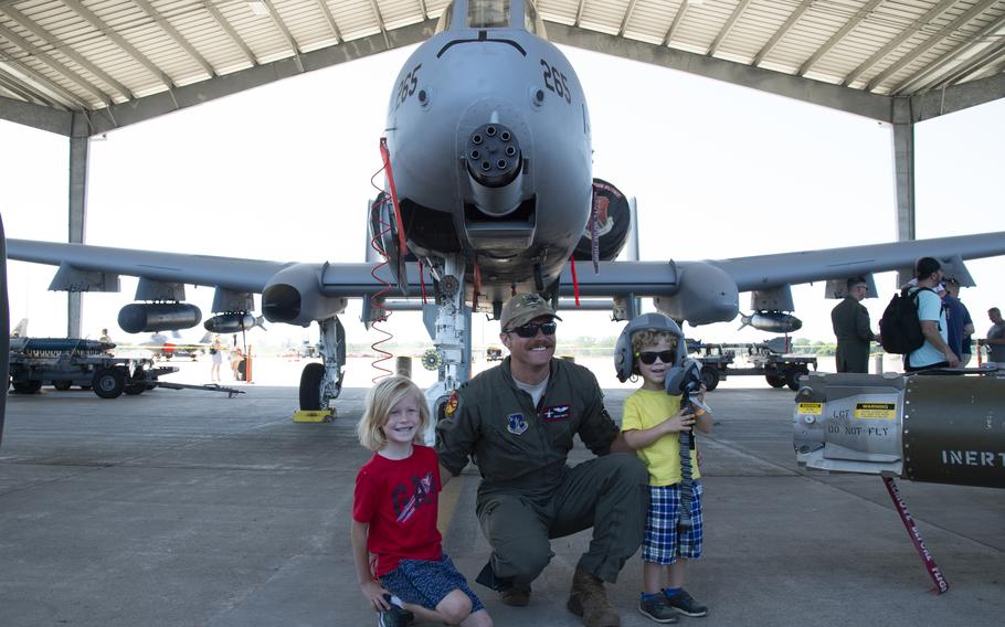 Capt. Zack Smith of the 107th Fighter Squadron, Selfridge Air National Guard Base, Mich. (SANGB), poses in front of an A-10 Thunderbolt with children attending the Selfridge Air Show.