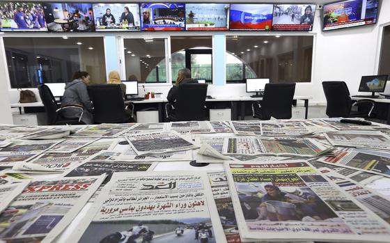 Newspapers rest on a table at a private television broadcaster in Algiers, Tuesday, March 19, 2024. Algerian officials are chiding television stations over the content choices they've made during Ramadan. Their criticisms come amid broader struggles facing journalists and broadcasters, which have historically relied heavily on advertising from the state and Sonatrach, its largest oil and gas company. (AP Photo/Anis Belghoul)
