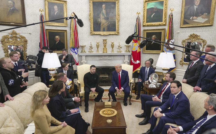 President Donald Trump and cabinet members meet in the Oval Office.