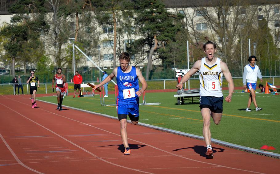 Ansbach’s Lucas Morecraft beats out Ramstein’s Gideon Zaugg during the 4x400-meter relay during the DoDEA Europe Kaiserslautern Track and Field Invitational on Saturday, April 16, 2022, in Kaiserslautern, Germany. 