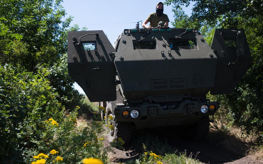 A Ukrainian serviceman is seen with a HIMARS in July. 