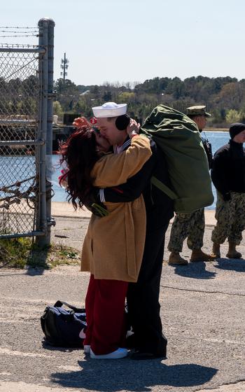 Logistics Specialist 2nd Class Tyler Smith, assigned to the Harpers Ferry-class dock landing ship USS Carter Hall (LSD 50), part of the Bataan Amphibious Ready Group (ARG), greets his family as the Carter Hall returns to Joint Expeditionary Base Little Creek-Fort Story, Thursday, March 21, 2024.