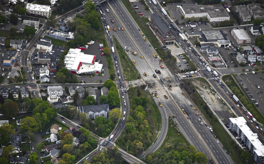 This aerial view looking south shows demolition crews working to finish removing the Fairfield Avenue bridge over Interstate 95, Saturday, May 4, 2024, in Norwalk, Conn.