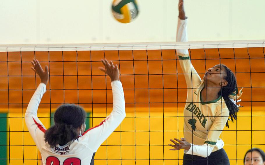 Robert D. Edgren’s Elizabeth Johnson spikes past Nile C. Kinnick’s Makeda Walker during Saturday’s Japan volleyball match. 