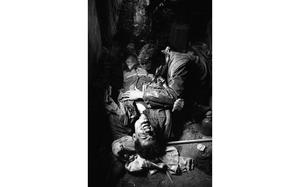 Hue, South Vietnam, Feb. 1968: Wounded Marine, lies bleeding in a vacant villa as a fellow Marine, also wounded, tries to tend to his wounds. Several Marines from D Company, 1st Battalion, Fifth Marines, many of them wounded, took shelter in the villa after a fierce firefight with the enemy in the streets of Hue. U.S. Marines have been battling VC and NVA house by house, street by street, brick by brick in a bloody effort to retake the former capital of Vietnam and its Citadel. 

Looking for Stars and Stripes’ coverage of the Vietnam War? Subscribe to Stars and Stripes’ historic newspaper archive! We have digitized our 1948-1999 European and Pacific editions, as well as several of our WWII editions and made them available online through https://starsandstripes.newspaperarchive.com/

META TAGS: Vietnam War; combat; Tet offensive; D Company; 1st Battalion; Fifth Marines; USMC; Marine Corps; Marines; casualty; wounded; WIA