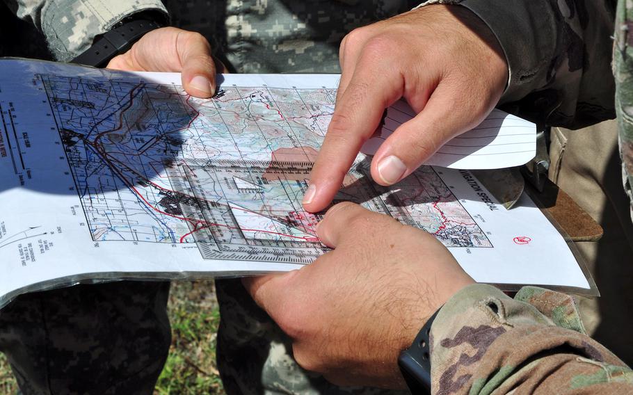 A closeup of fingers pointing at a map.