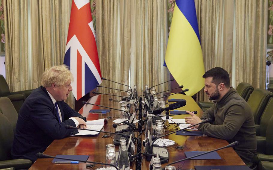 Ukrainian President Volodymyr Zelenskyy, right, and Britain’s Prime Minister Boris Johnson speak during their meeting in Kyiv, Ukraine, Saturday, April 9, 2022.  
