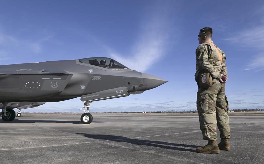 U.S. Air Force Staff Sgt. Christian Fischer, a tactical aircraft maintenance specialist with the Wisconsin Air National Guard’s 115th Fighter Wing, assists an F-35A Lightning II pilot with preflight tasks Feb. 13, 2024, during a Weapons System Evaluation Program exercise at Tyndall Air Force Base, Fla. The Combat Archer exercise was a formal evaluation of the unit’s ability to conduct air-to-air live-fire missions. 