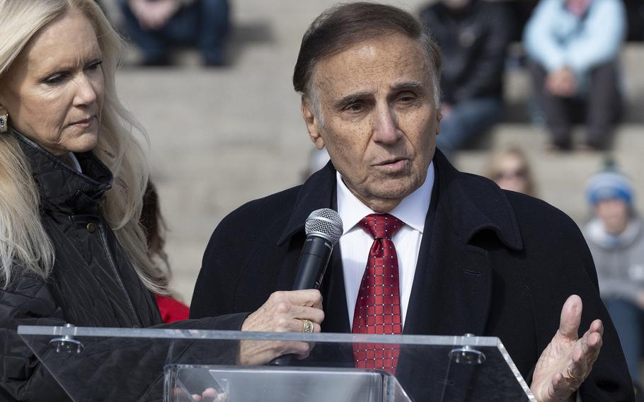 Actor Tony LoBianco reads a tribute to service members before the National Veterans Day Parade on Sunday, Nov. 12, 2023, in Washington. 