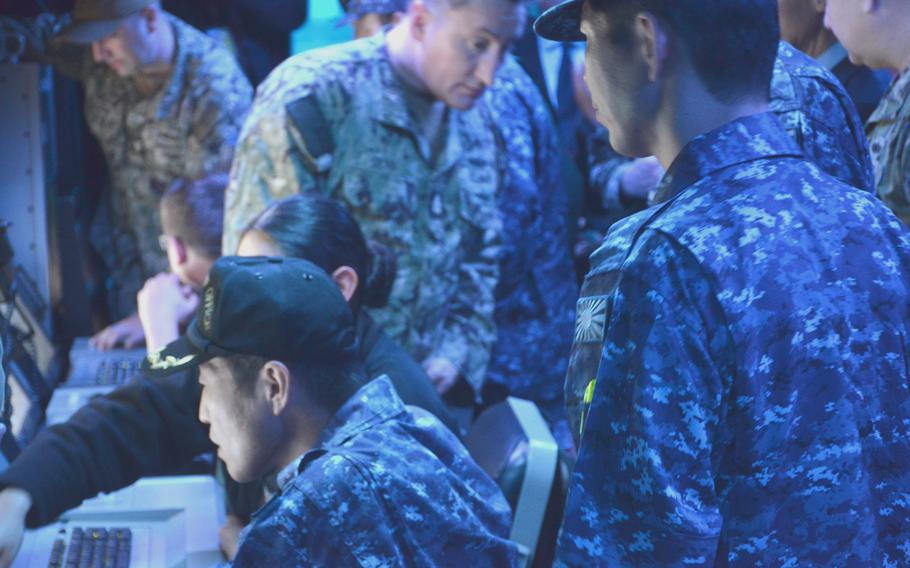 Japan Maritime Self-Defense Force officers train on Tomahawk cruise missiles aboard the USS McCampbell at Yokosuka Naval Base, Japan, on March 28, 2024. 