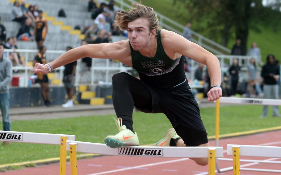 Kubasaki's Caleb Stephan clips the final hurdle en route to winning the 110 hurdles in 16.7 seconds during Tuesday's Okinawa track and field meet.