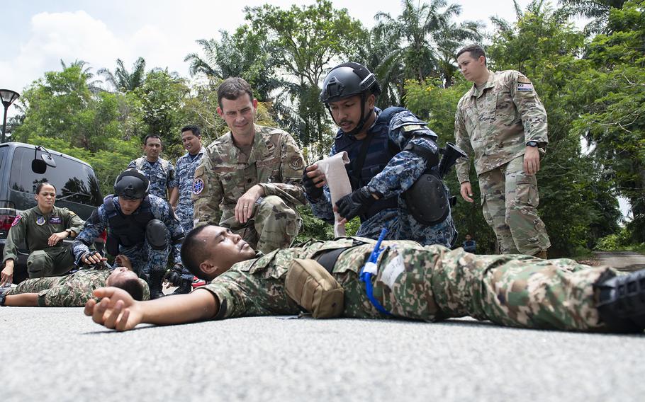U.S. and Malaysian military medical professionals take part in a mass casualty training scenario during Exercise Pacific Angel at Subang Air Base, Malaysia, Aug. 16, 2022. 