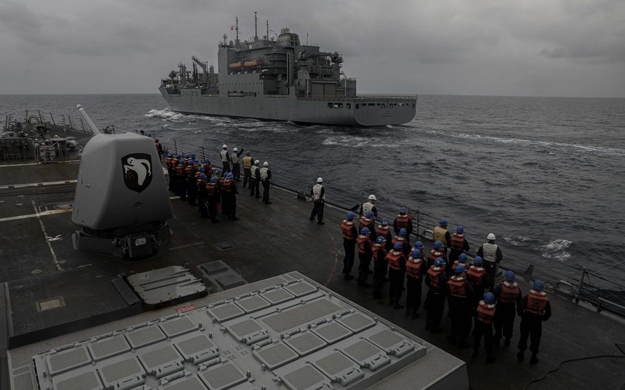 The cargo ship USNS Cesar Chavez, named for the farm workers rights advocate and World War II Navy veteran, transfers supplies to the destroyer USS Milius in March 2023.