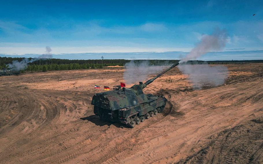 A German Panzerhaubitze 2000 howitzer fires during training in Lithuania as part of NATO’s enhanced forward presence in July. Last month, heads of state and government participating in the NATO summit in Lithuania pledged to boost spending on defense. 