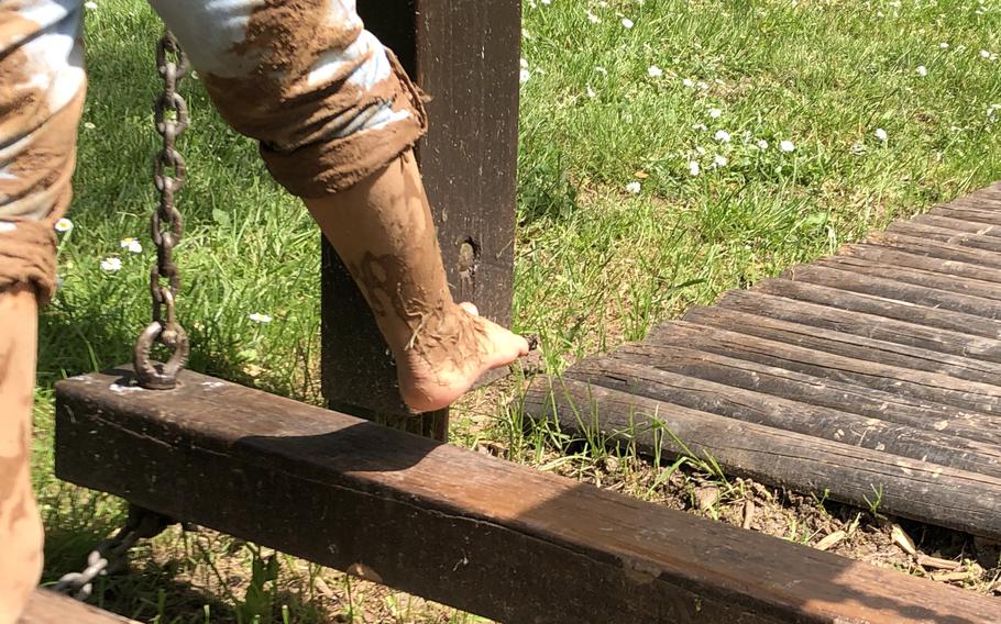 Balance beams challenge barefoot hikers after their trip through the mud basin at the barefoot park in Bad Sobernheim, Germany. 