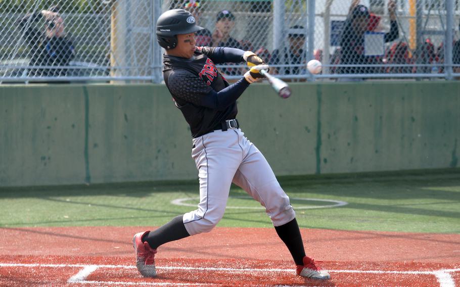 Neo Purificacion swings the bat.