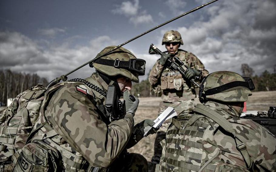 Polish and U.S. soldiers practice medical evacuation scenarios in February 2022 at the Nowa Deba training ground in southeast Poland. Soldiers from the 82nd and 101st airborne divisions deployed to NATO's eastern flank to reassure allies worried about potential Russian aggression. 