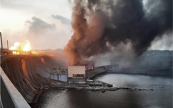 Smoke and fire rise over the Dnipro hydroelectric power plant after Russian attacks in Dnipro, Ukraine, on March 22, 2024.