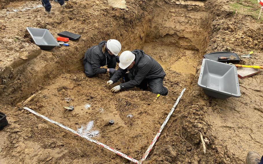 A team of specialists contracted by the PFC Lawrence Gordon Foundation disinters remains from a mass grave at the Marigny German War Cemetery in Thereval, France, in December 2023.