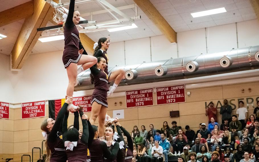 Kimberly Munger, top left, S’ence Maldonado and Paloma Gomez are supported by their fellow Vilseck High School teammates during the 2023 DODEA-Europe Cheerleading Championships at Kaiserslautern High School on Friday, Feb. 18.