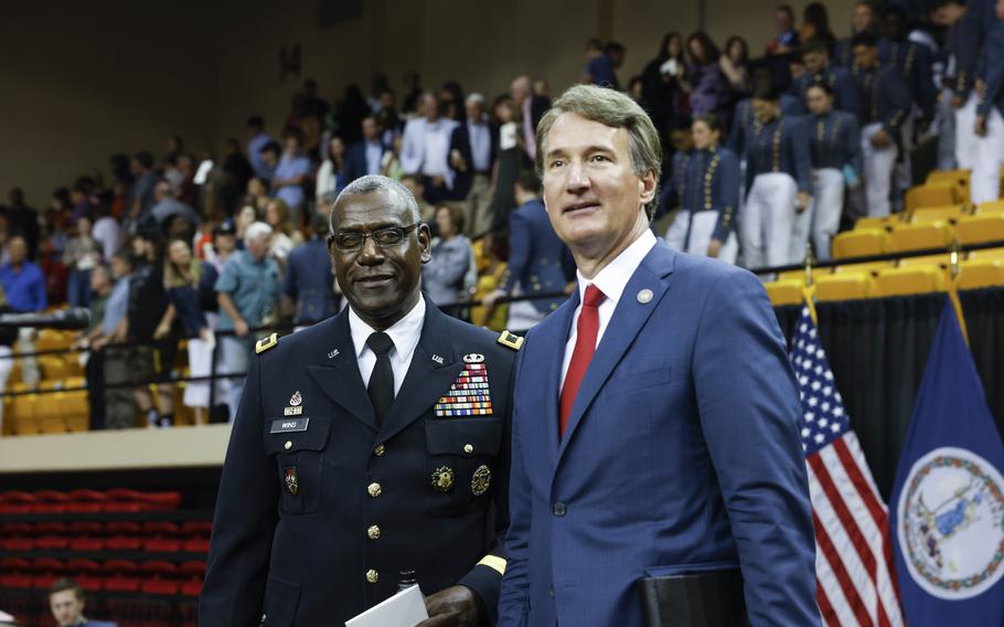 Virginia Gov. Glenn Youngkin, right, with VMI's superintendent, Maj. Gen. Cedric T. Wins, at Tuesday's commencement.
