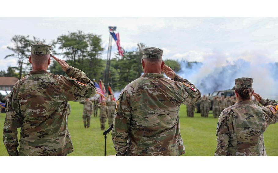 Three soldiers salute