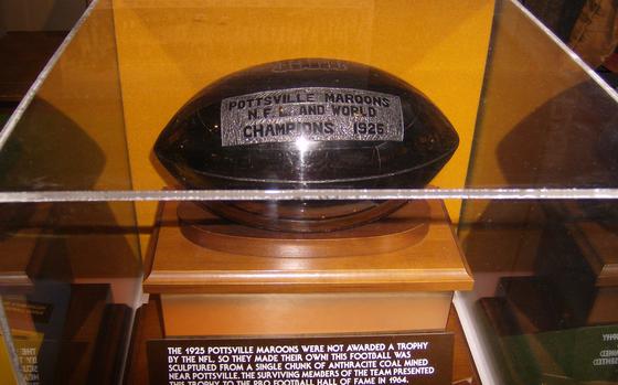 A trophy football made of anthracite coal.