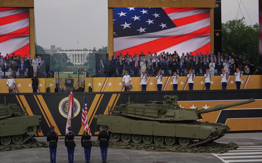 The National Anthem is performed as President Donald Trump attends a military parade.