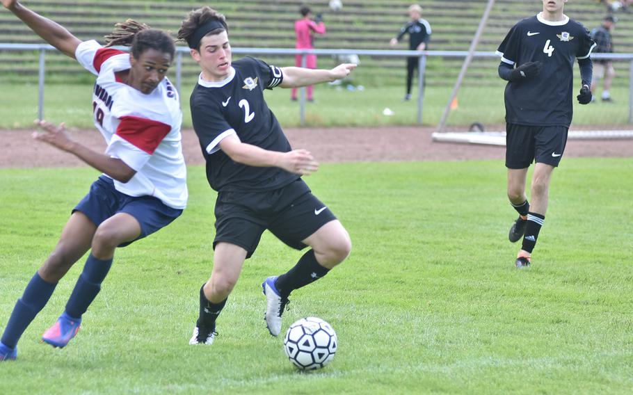 Aviano's Deon Walker and Bahrain's Mason Leach battle for the ball on Tuesday, May 17, 2022, at the DODEA-Europe boys Division II championships at Landstuhl, Germany.
