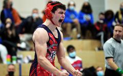 Lakenheath’s Stephen Kofron, celebrates after defeating  Ramstein’s Caden Umphlet-Martinez in overtime in an exciting 165-pound title match at the high school 2022 Wrestling Tournament in Ramstein, Germany, Feb. 12, 2022.