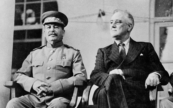 Soviet leader Joseph Stalin, left, appears with President Franklin D. Roosevelt at the Russian Embassy in Tehran in 1943. 